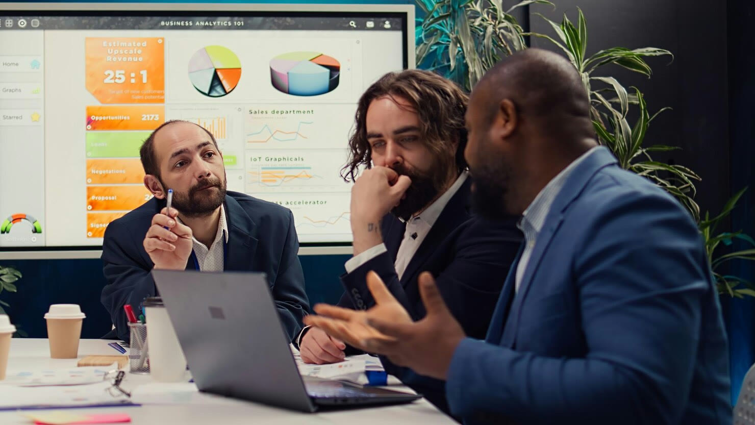 Business team in a meeting reviewing a presentation